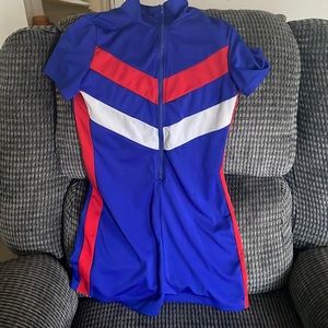 im selling a blue body suit that has red and white on it.